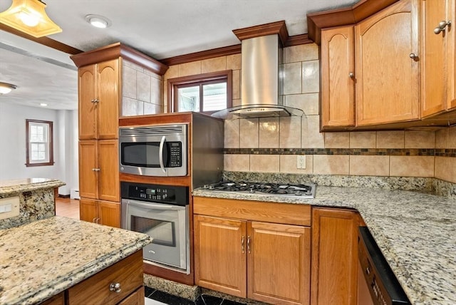 18 Newhall St, Malden, MA 02148 - kitchen featuring stainless steel appliances, island range hood, backsplash, light stone countertops, and brown cabinets