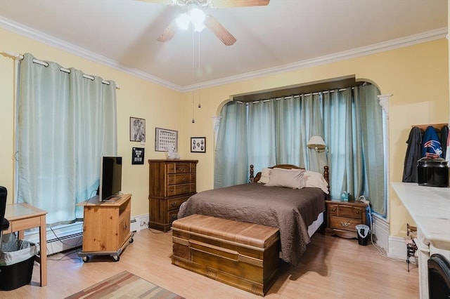 bedroom featuring light wood finished floors, ornamental molding, a baseboard radiator, a baseboard heating unit, and ceiling fan