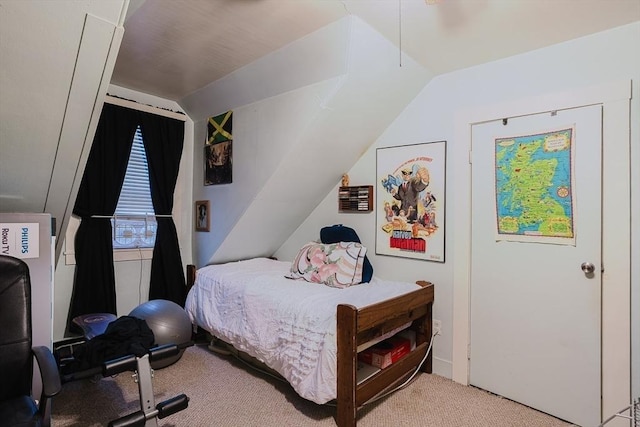carpeted bedroom with vaulted ceiling