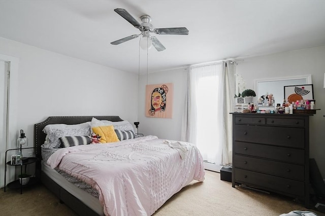 bedroom with carpet floors, a baseboard radiator, and ceiling fan