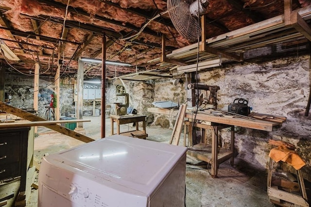 unfinished below grade area with washer / dryer