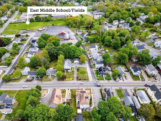 aerial view of property's location with nearby suburban area