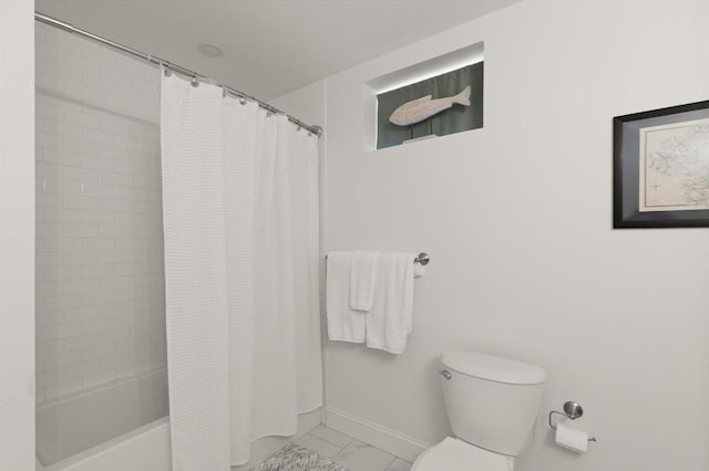 25 Conant St Unit 1, Danvers, MA 01923 - bathroom with marble look tiles, toilet, baseboards, and shower / bath combo with shower curtain