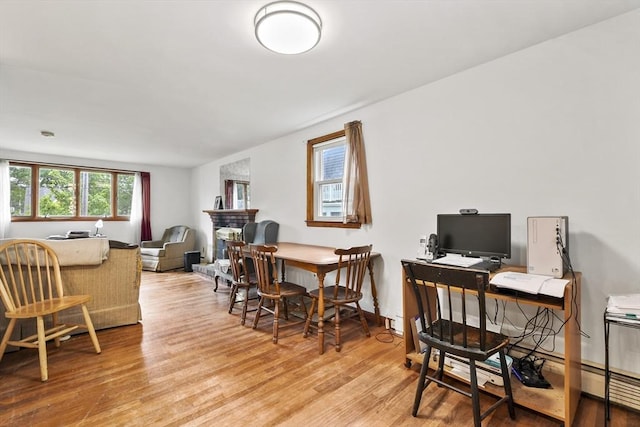 40 Winslow Rd, Quincy, MA 02171 - dining area featuring wood finished floors and a baseboard heating unit