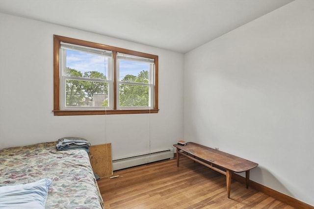 40 Winslow Rd, Quincy, MA 02171 - bedroom featuring a baseboard heating unit and light wood-style flooring