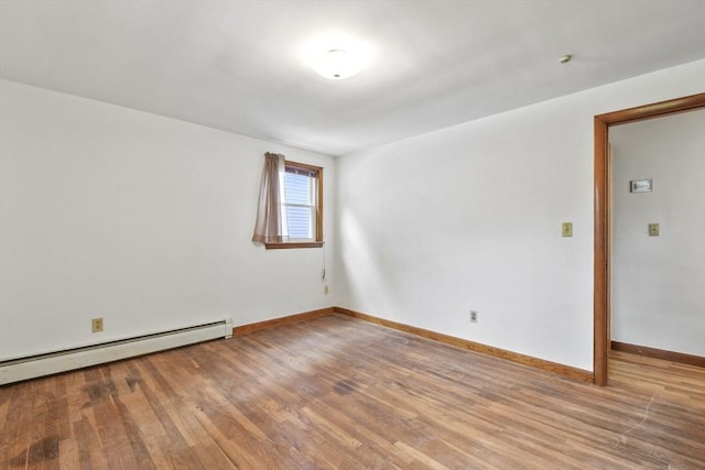 40 Winslow Rd, Quincy, MA 02171 - spare room with wood finished floors and a baseboard heating unit