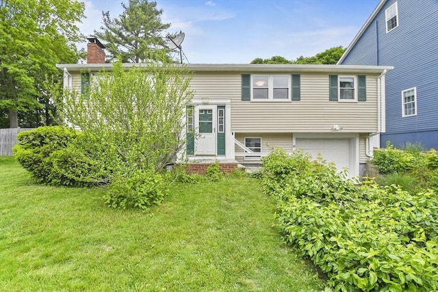 40 Winslow Rd, Quincy, MA 02171 - view of front facade with a chimney and a garage