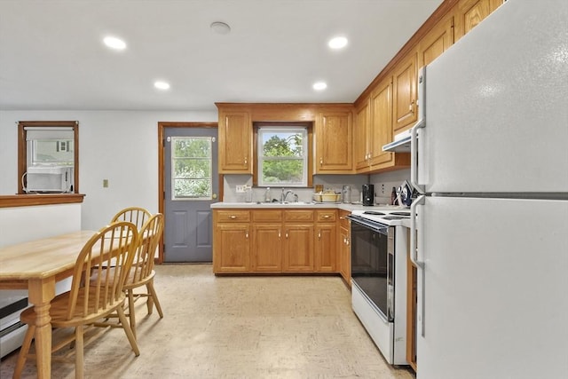 40 Winslow Rd, Quincy, MA 02171 - kitchen featuring white appliances, light countertops, recessed lighting, brown cabinets, and light flooring