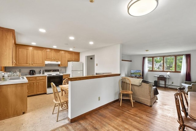 40 Winslow Rd, Quincy, MA 02171 - kitchen featuring white appliances, ventilation hood, light countertops, recessed lighting, and light wood-type flooring