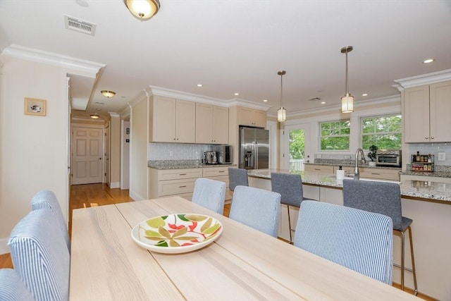 324 Front St Unit 4, Marion, MA 02738 - dining area featuring light wood-type flooring, ornamental molding, and recessed lighting