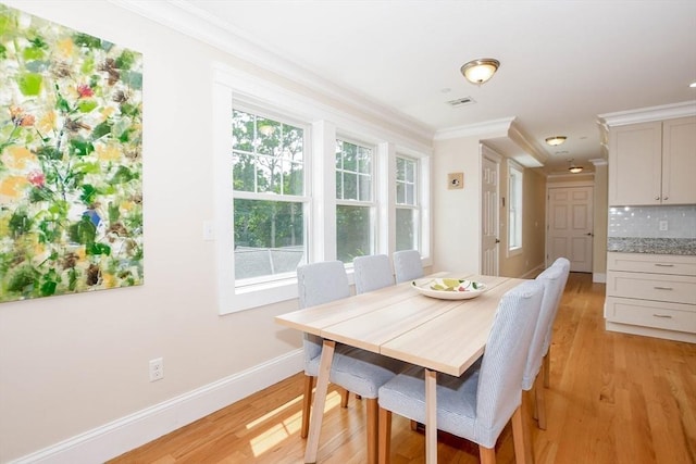 324 Front St Unit 4, Marion, MA 02738 - dining area featuring light wood-type flooring and crown molding