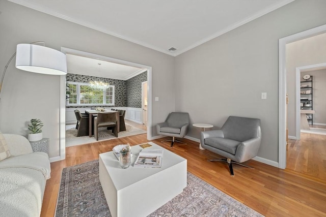 living room with a chandelier and hardwood / wood-style floors