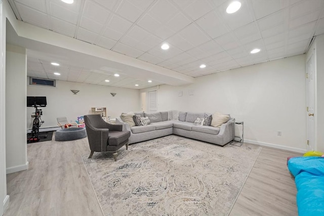 living room with light hardwood / wood-style floors and a baseboard radiator