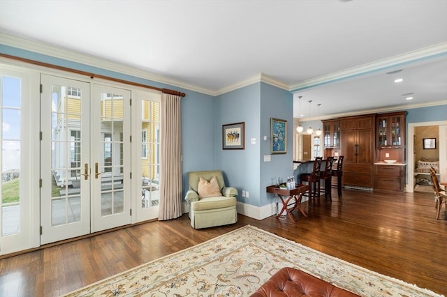living area featuring dark wood-style flooring, french doors, recessed lighting, baseboards, and ornamental molding