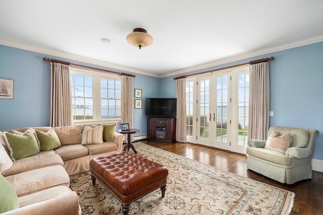 living area featuring crown molding, baseboards, french doors, and wood finished floors