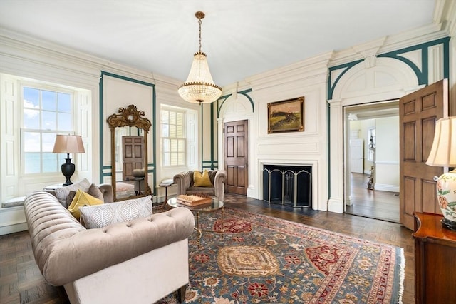 living room with a large fireplace and a decorative wall