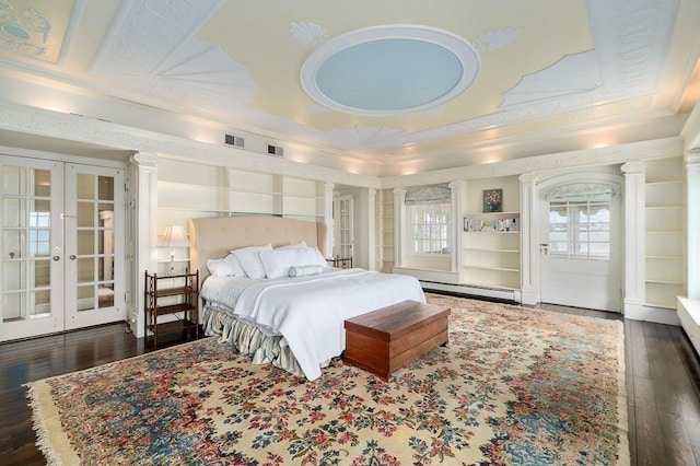 bedroom with visible vents, ornamental molding, hardwood / wood-style flooring, french doors, and a baseboard radiator