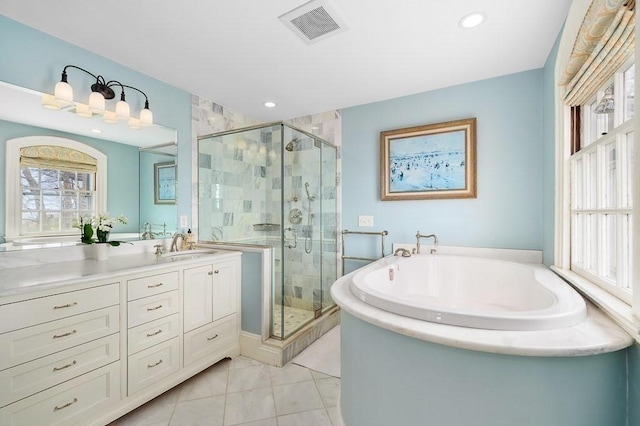 bathroom featuring visible vents, vanity, a garden tub, and a shower stall
