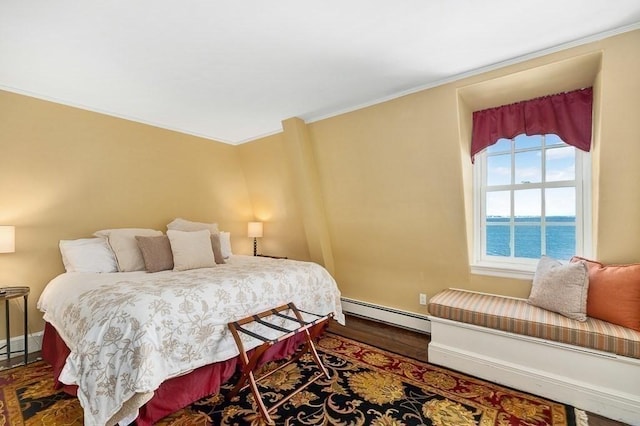 bedroom featuring crown molding, baseboards, a baseboard radiator, and dark wood-type flooring