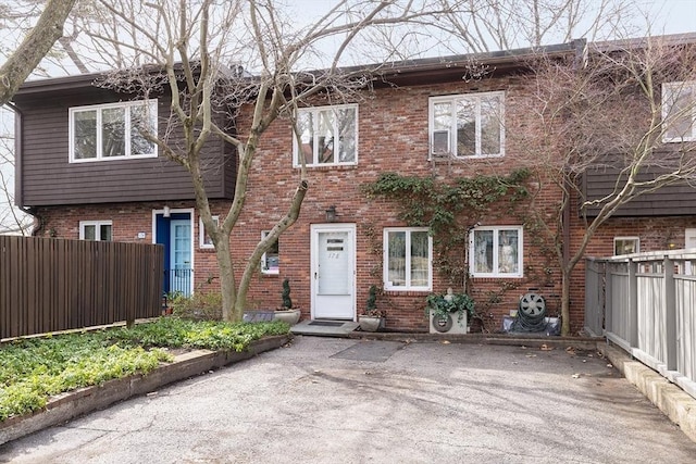 178 Rawson Rd, Brookline, MA 02445 - view of front of property featuring brick siding and fence