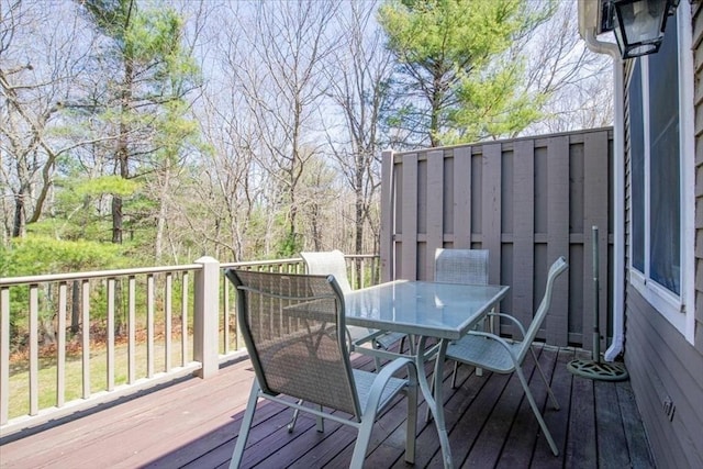 deck with outdoor dining area