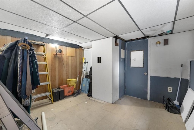 basement featuring a drop ceiling