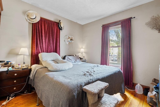 bedroom with wood-type flooring