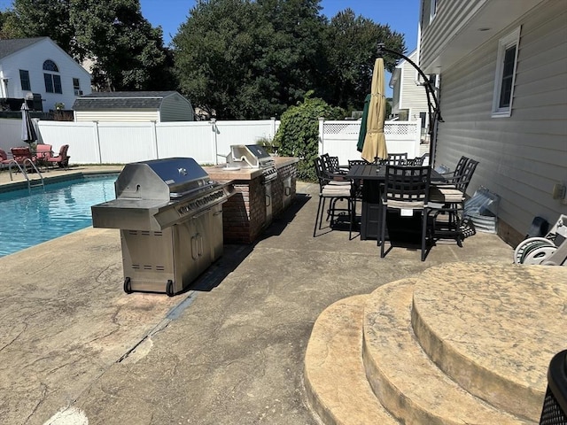 6 Yellow Brick Rd, Haverhill, MA 01835 - view of patio / terrace featuring a fenced in pool, outdoor dining area, a fenced backyard, an outdoor kitchen, and a grill