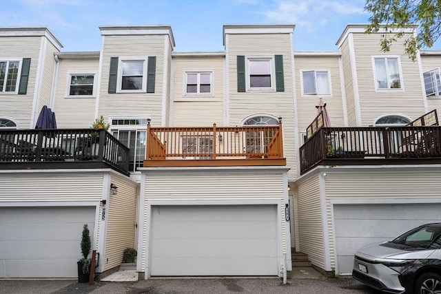 103 Claybourne Unit 103, Boston, MA 02124 - back of house featuring a garage and a balcony