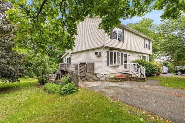 30 Taylor St Unit 1, Haverhill, MA 01832 - view of front of home featuring a front lawn and a wooden deck
