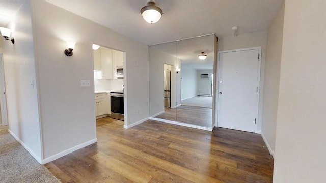 10 Williams Unit 39, Watertown, MA 02472 - corridor featuring wood finished floors and baseboards