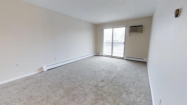 10 Williams Unit 39, Watertown, MA 02472 - empty room with a wall unit AC, a baseboard radiator, and carpet