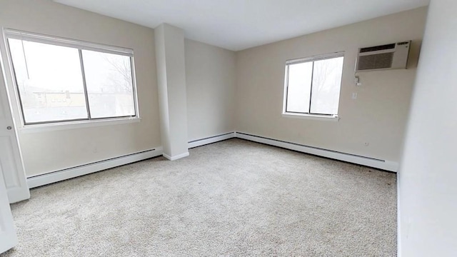 10 Williams Unit 39, Watertown, MA 02472 - carpeted spare room featuring a baseboard radiator, a wall mounted AC, and baseboards