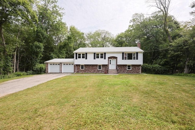 286 Mountain St, Sharon, MA 02067 - raised ranch featuring entry steps, a chimney, brick siding, a front yard, and driveway