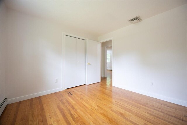 286 Mountain St, Sharon, MA 02067 - unfurnished room featuring light wood finished floors and a baseboard radiator