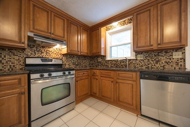 286 Mountain St, Sharon, MA 02067 - kitchen featuring stainless steel appliances, under cabinet range hood, and brown cabinets