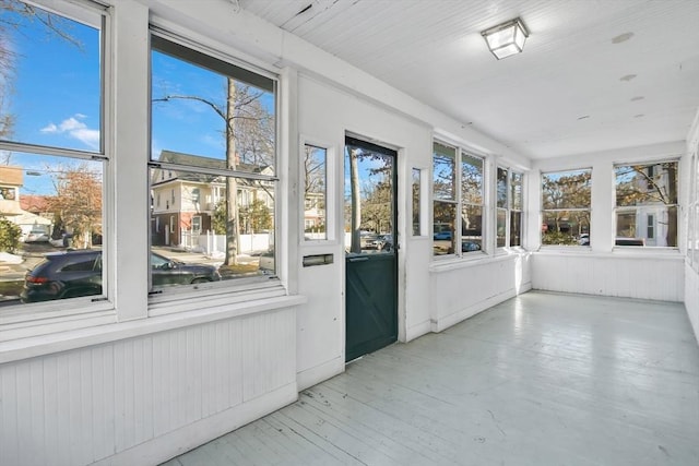 unfurnished sunroom with a wealth of natural light