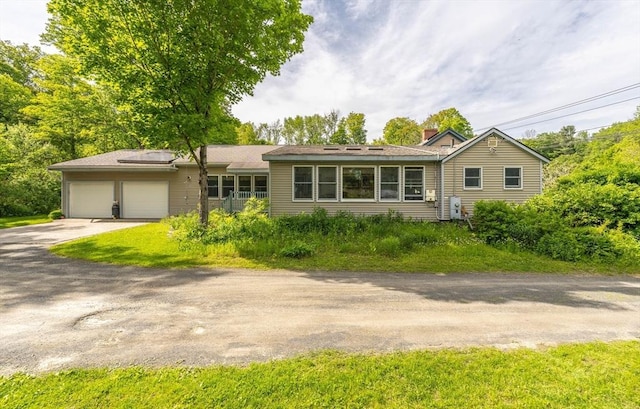 52 Searle Rd, Huntington, MA 01050 - ranch-style house with asphalt driveway, an attached garage, and a chimney