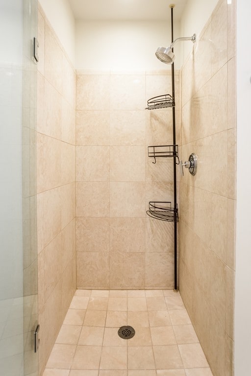 bathroom with a shower with shower door