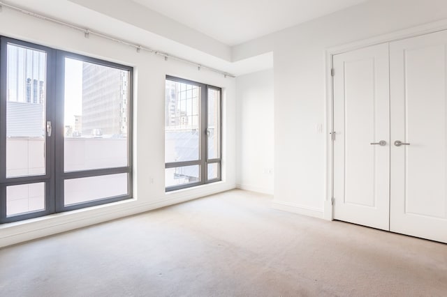 unfurnished bedroom with light carpet