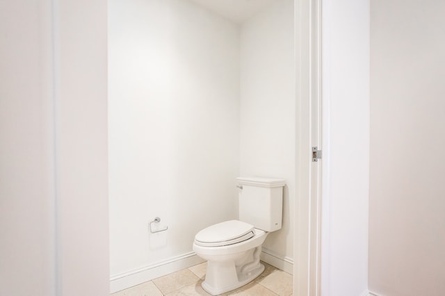 bathroom featuring tile patterned floors and toilet