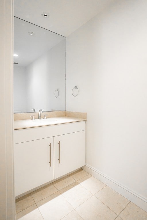 bathroom featuring tile patterned floors and vanity