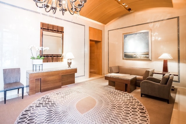 living area featuring brick ceiling, carpet floors, lofted ceiling, and a notable chandelier