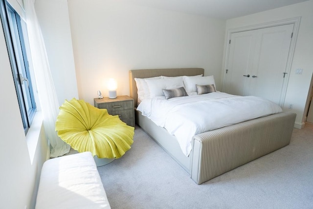 carpeted bedroom with a closet