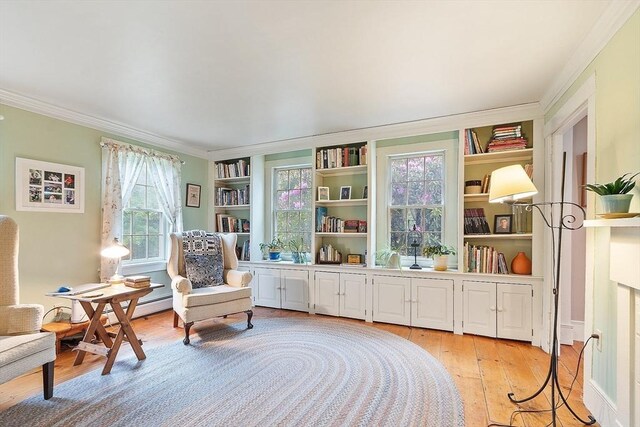 34 Fletcher Ln, Littleton, MA 01460 - sitting room featuring ornamental molding, light wood-type flooring, and built in features