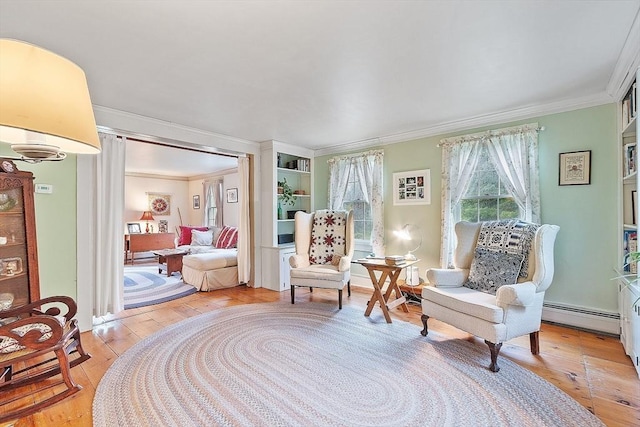 34 Fletcher Ln, Littleton, MA 01460 - sitting room featuring a baseboard radiator, crown molding, and light wood-type flooring