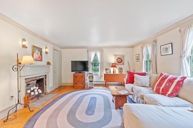 34 Fletcher Ln, Littleton, MA 01460 - living area with ornamental molding, wood finished floors, healthy amount of natural light, a fireplace with flush hearth, and a baseboard heating unit
