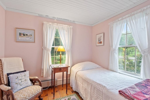 34 Fletcher Ln, Littleton, MA 01460 - bedroom with a baseboard heating unit, light wood-style floors, ornamental molding, and wooden ceiling
