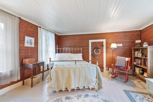 34 Fletcher Ln, Littleton, MA 01460 - bedroom featuring wooden walls and light wood-style flooring
