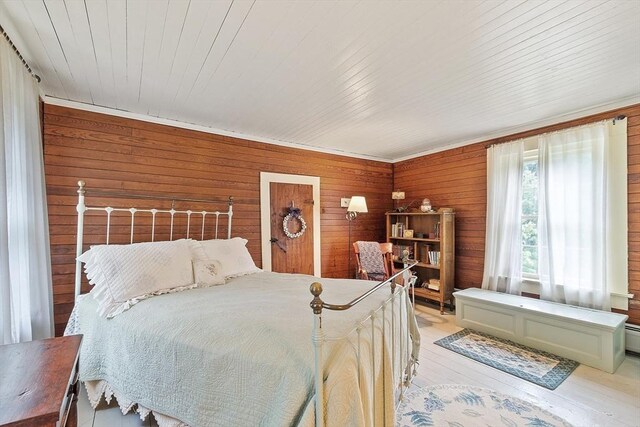 34 Fletcher Ln, Littleton, MA 01460 - bedroom featuring light wood finished floors and wood walls